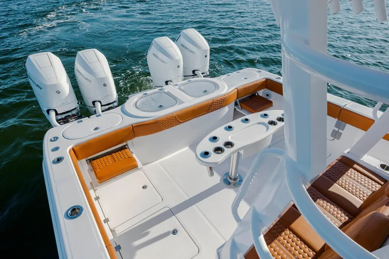  Yacht Photos Pics 2024 Invincible 46 Pilothouse boat with quad Mercury engines on open water.