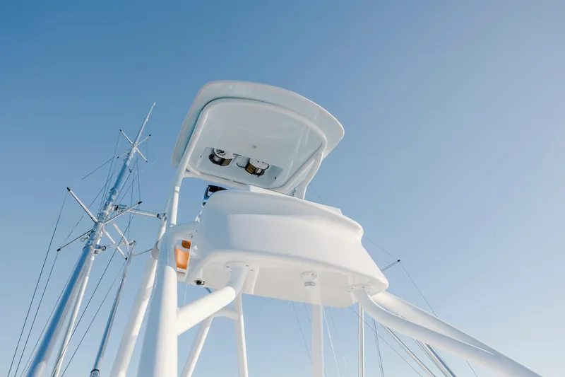  Yacht Photos Pics 2024 Invincible 46 Pilothouse tower against clear blue sky.