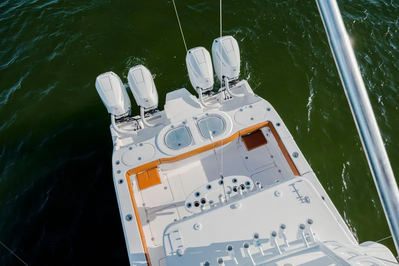  Yacht Photos Pics 2024 Invincible 46 Pilothouse boat with four powerful engines on open water.