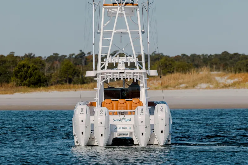  Yacht Photos Pics 2024 Invincible 46 Pilothouse boat with quad engines on open water.