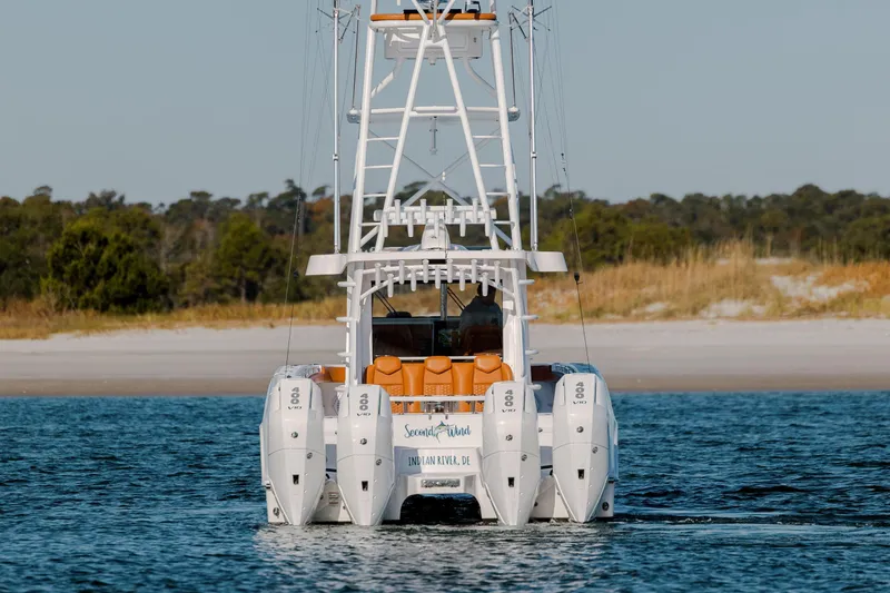  Yacht Photos Pics 2024 Invincible 46 Pilothouse boat with quad engines on open water.