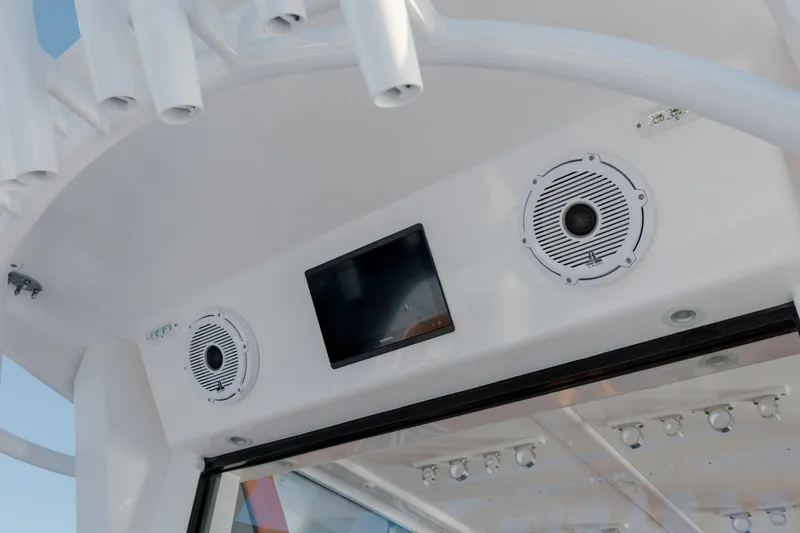  Yacht Photos Pics 2024 Invincible 46 Pilothouse interior with speakers and display screen.