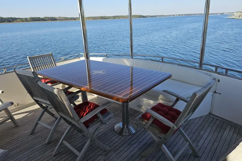 Yacht Photos Pics Outdoor dining area on 2003 Johnson FLY yacht with scenic water view.