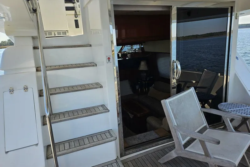  Yacht Photos Pics Staircase and seating area on 2003 Johnson FLY yacht with ocean view.