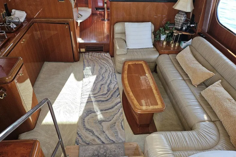  Yacht Photos Pics Luxurious 2003 Johnson FLY yacht interior with leather seating and elegant wood finishes.