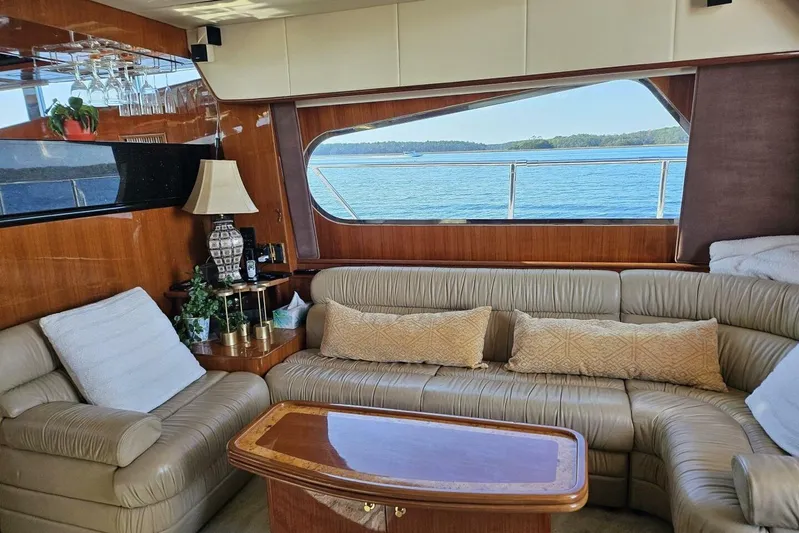  Yacht Photos Pics Luxurious 2003 Johnson FLY yacht interior with leather seating and ocean view.