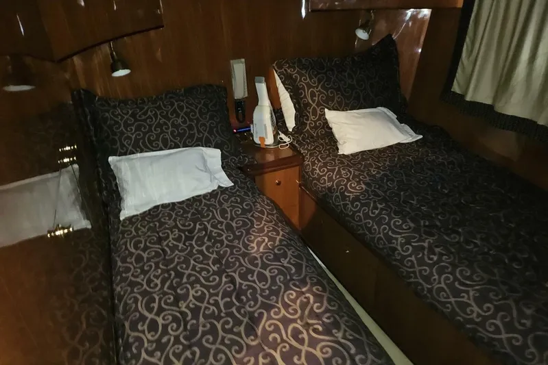  Yacht Photos Pics Twin beds in a 2003 Johnson FLY yacht cabin with patterned bedding.