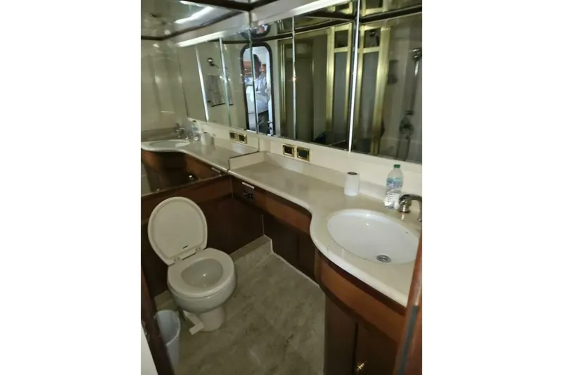  Yacht Photos Pics Luxurious yacht bathroom with mirror, sink, and toilet, Johnson FLY 2003 model.