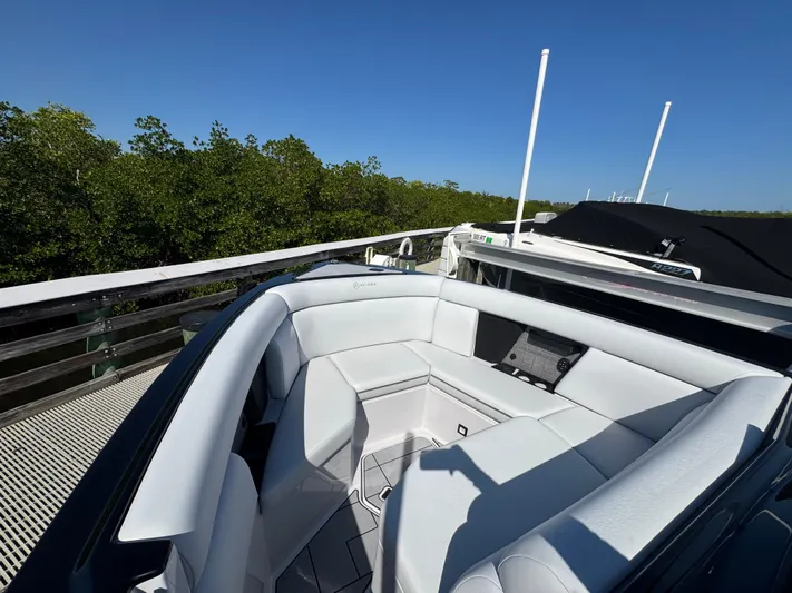  Yacht Photos Pics Luxurious interior of 2025 Aviara 28 Surf with white upholstery.