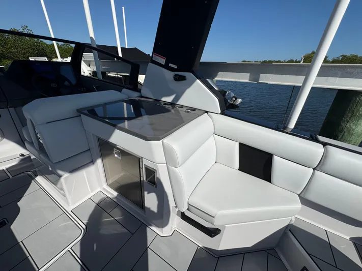  Yacht Photos Pics Interior of Aviara 28 Surf 2025 with sleek white seating.