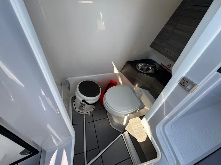  Yacht Photos Pics Interior of Aviara 28 Surf 2025 with toilet and sink.