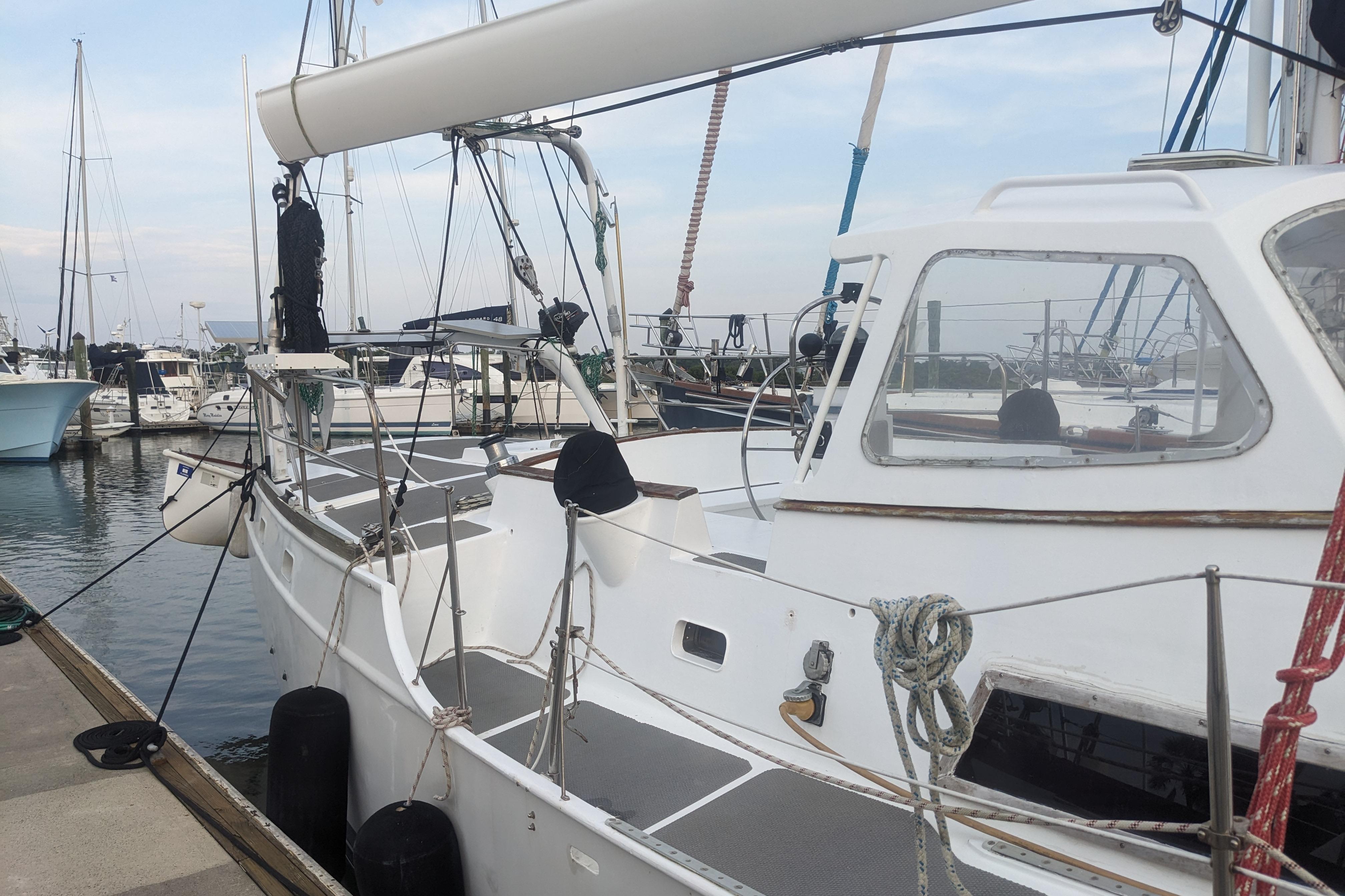 1992 Bruce Bingham Custom 47 Steel Hull sailboat docked at marina.