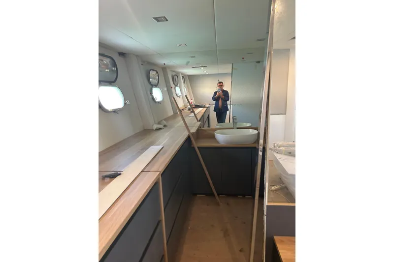  Yacht Photos Pics Interior of 1996 Overmarine Mangusta 100 yacht with modern design and porthole windows.