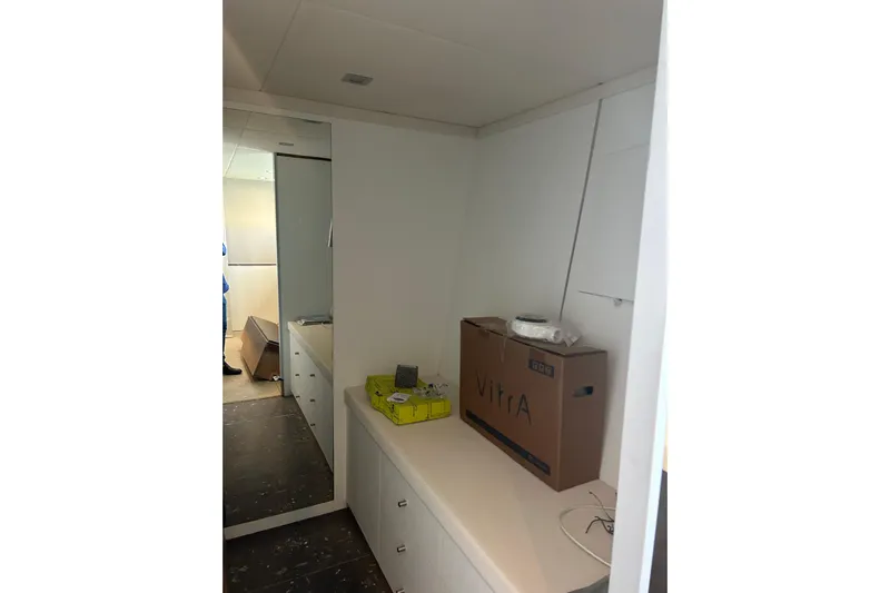  Yacht Photos Pics Interior of 1996 Overmarine Mangusta 100 yacht with storage boxes and mirror.