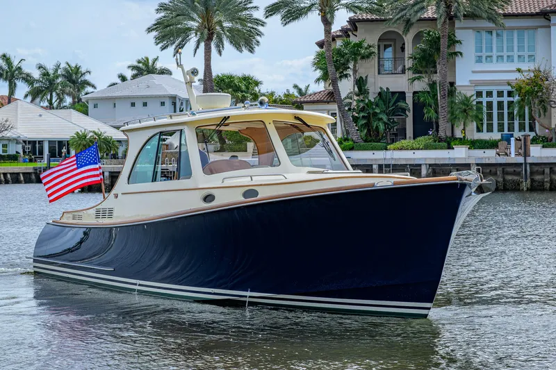 Mint Chip Yacht Photos Pics 2017 Hinckley Picnic Boat 37 MKIII cruising near waterfront homes.