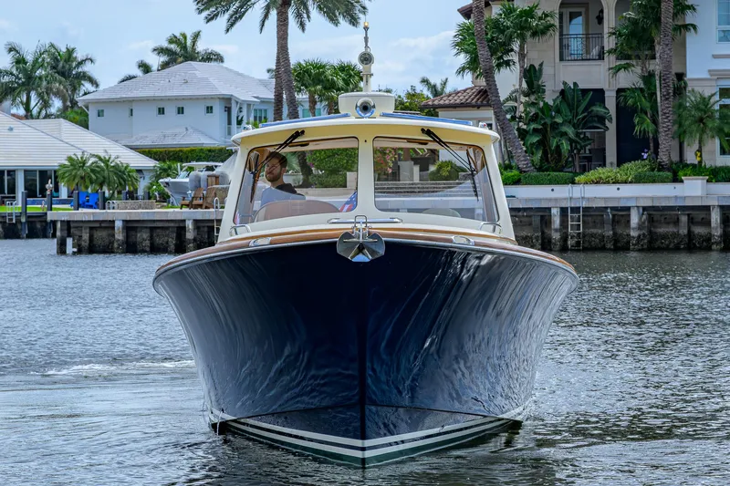 Mint Chip Yacht Photos Pics 2017 Hinckley Picnic Boat 37 MKIII cruising in a scenic waterfront setting.