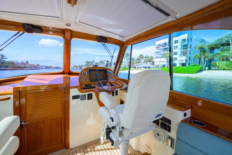 Mint Chip Yacht Photos Pics Helm of 2017 Hinckley Picnic Boat 37 MKIII with waterfront view and modern controls.