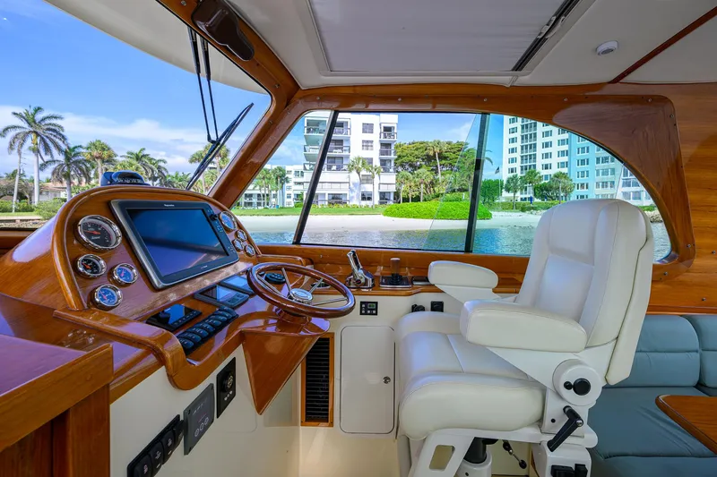 Mint Chip Yacht Photos Pics Interior of 2017 Hinckley Picnic Boat 37 MKIII with luxurious helm and waterfront view.