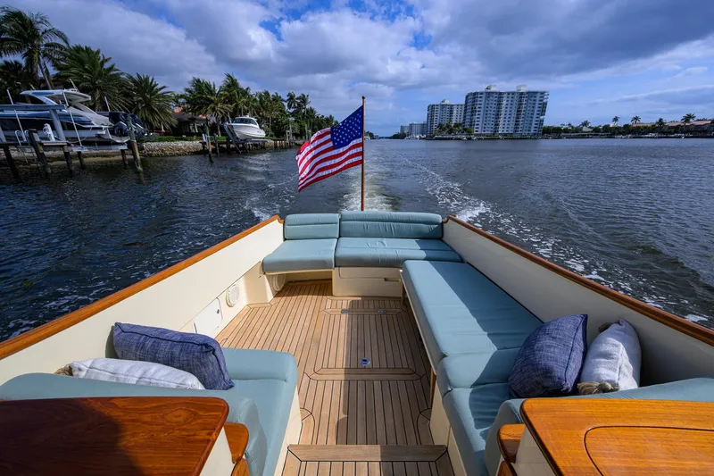 Mint Chip Yacht Photos Pics Hinckley Picnic Boat 37 MKIII, 2017, cruising with American flag, spacious seating, scenic waterfront view.
