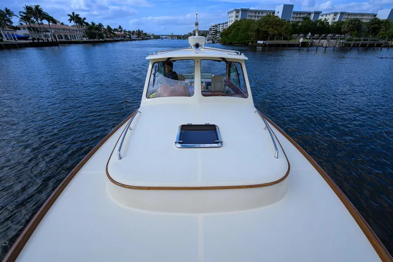 Mint Chip Yacht Photos Pics 2017 Hinckley Picnic Boat 37 MKIII cruising on a scenic waterway.
