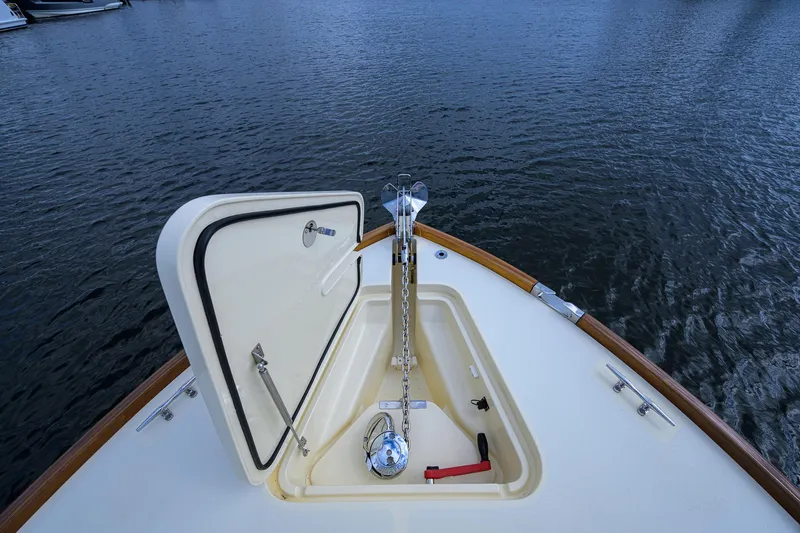 Mint Chip Yacht Photos Pics 2017 Hinckley Picnic Boat 37 MKIII anchor compartment open on calm water.