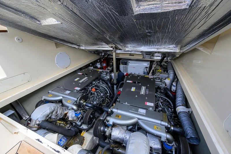 Mint Chip Yacht Photos Pics Engine room of 2017 Hinckley Picnic Boat 37 MKIII, showcasing dual engines and mechanical components.