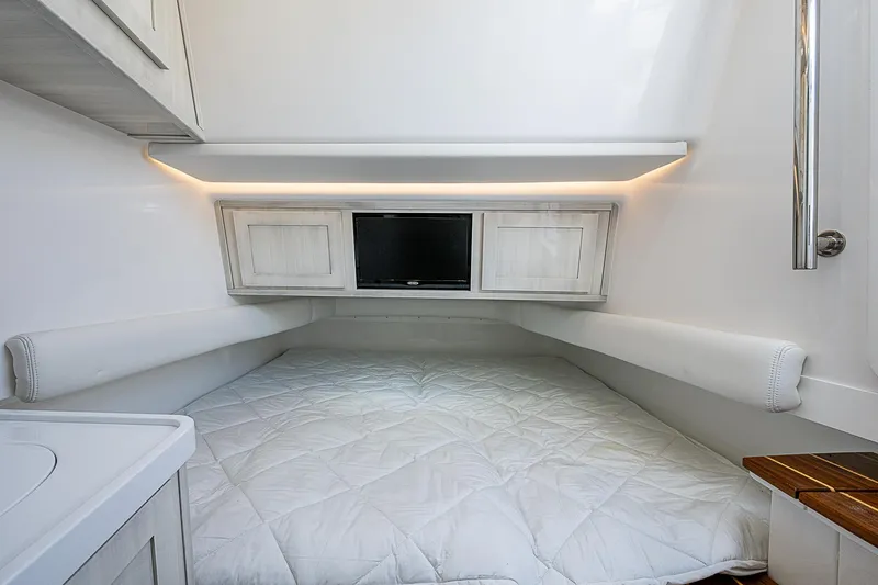  Yacht Photos Pics Luxurious cabin interior of 2023 HCB 53 Sueños with cozy bedding and modern lighting.