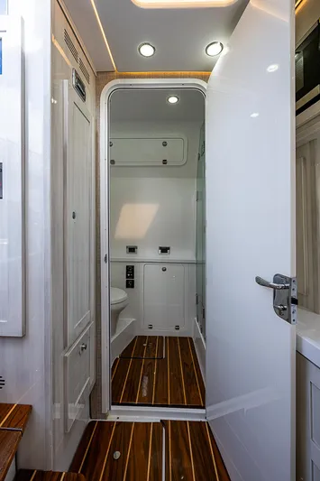  Yacht Photos Pics 2023 HCB 53 Sueños yacht interior with sleek bathroom design and wooden flooring.