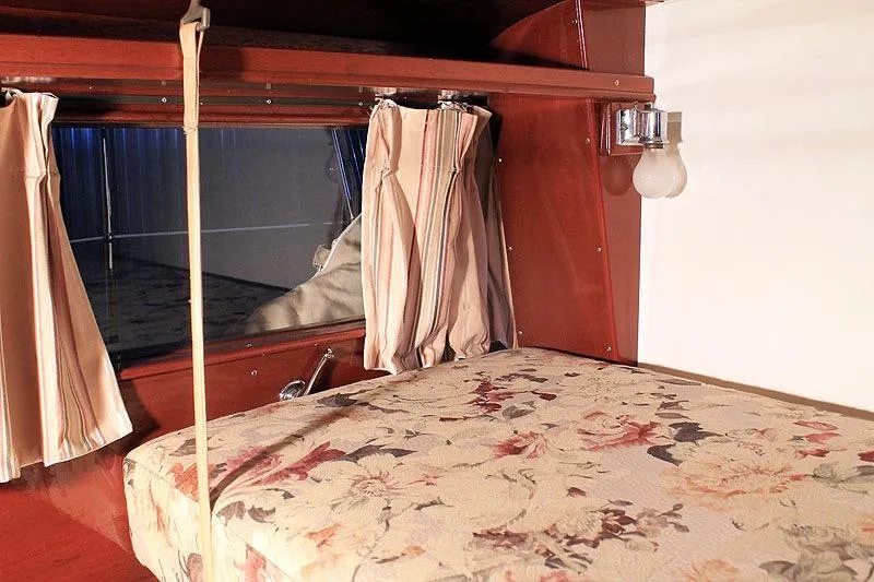 Allez Yacht Photos Pics Interior of a 1930 Chris-Craft Commuter with floral upholstery and wooden accents.