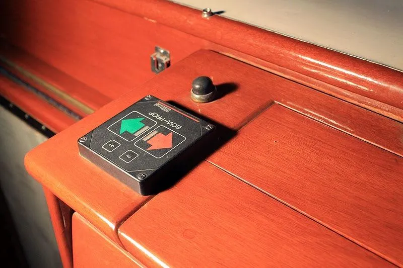 Allez Yacht Photos Pics 1930 Chris-Craft Commuter boat control panel with bow propeller switch on wooden surface.