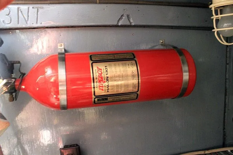 Allez Yacht Photos Pics Red fire extinguisher mounted inside a 1930 Chris-Craft Commuter boat.