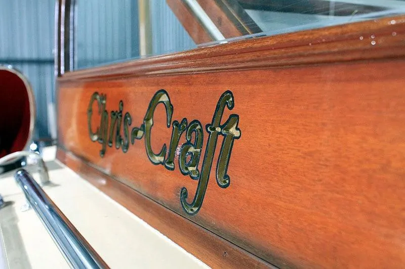 Allez Yacht Photos Pics Close-up of 1930 Chris-Craft Commuter wooden boat logo.