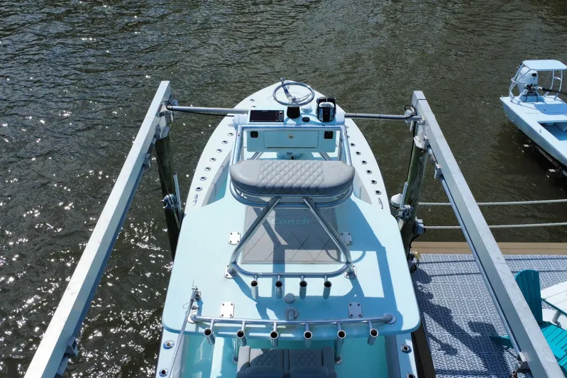  Yacht Photos Pics 2018 Conch 30 boat docked on water, aerial view.