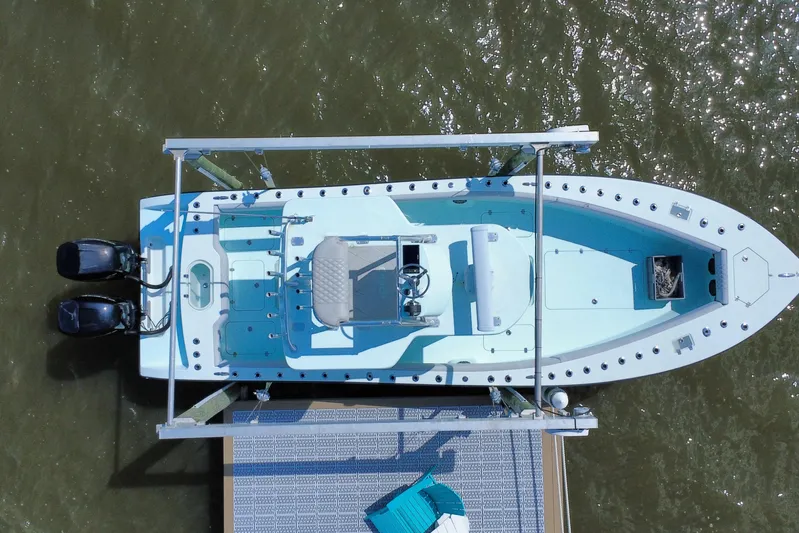  Yacht Photos Pics Aerial view of 2018 Conch 30 boat docked, featuring dual engines and spacious deck.