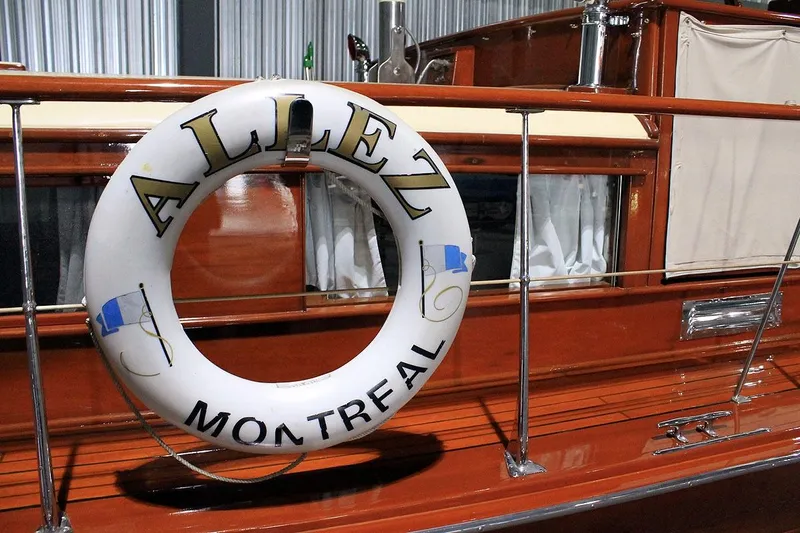 Allez Yacht Photos Pics 1930 Chris-Craft Commuter boat with "Allez Montreal" life preserver on deck.
