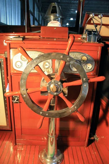 Allez Yacht Photos Pics 1930 Chris-Craft Commuter boat steering wheel and dashboard, showcasing vintage nautical design.