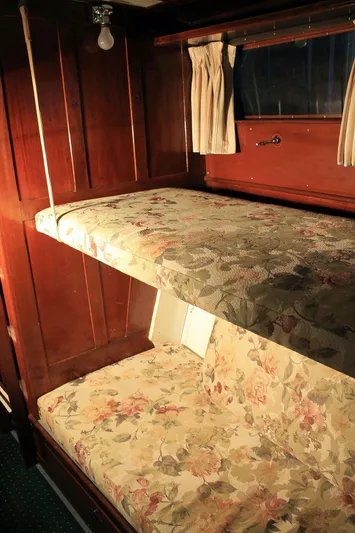 Allez Yacht Photos Pics 1930 Chris-Craft Commuter interior with vintage wooden bunk beds and floral upholstery.