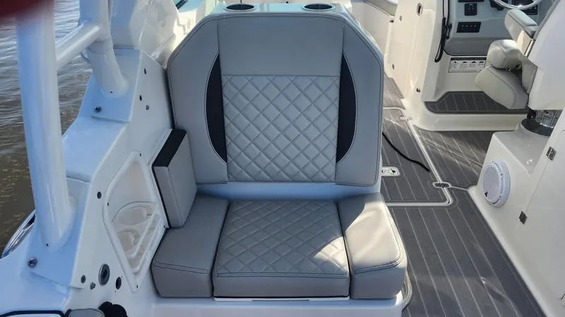  Yacht Photos Pics 2024 Pursuit DC 266 Dual Console boat interior with gray quilted seating.