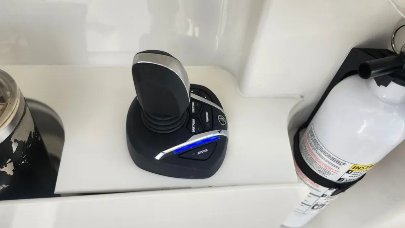 Yacht Photos Pics Joystick control and fire extinguisher on 2024 Pursuit DC 266 Dual Console boat.