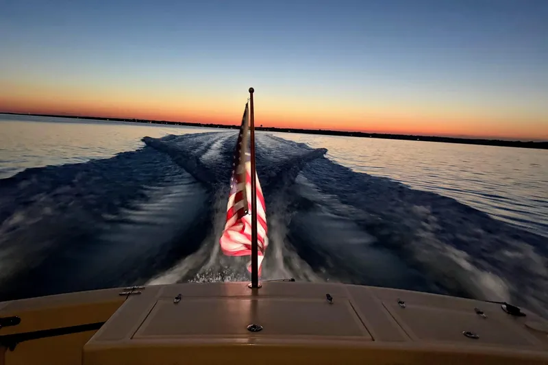  Yacht Photos Pics Sunset view from a 2000 Hunt Yachts 28 Express, American flag waving.
