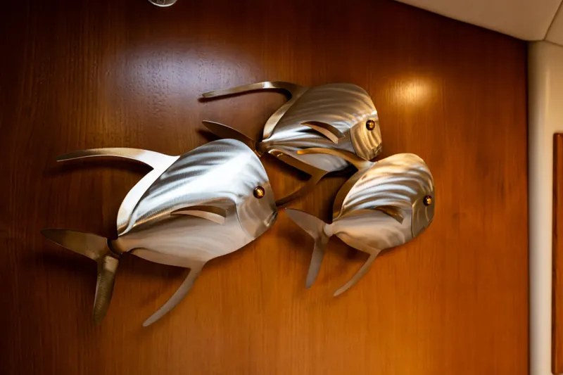 Yacht Photos Pics Metal fish wall art on Riviera 37 Flybridge yacht, 2004 model.