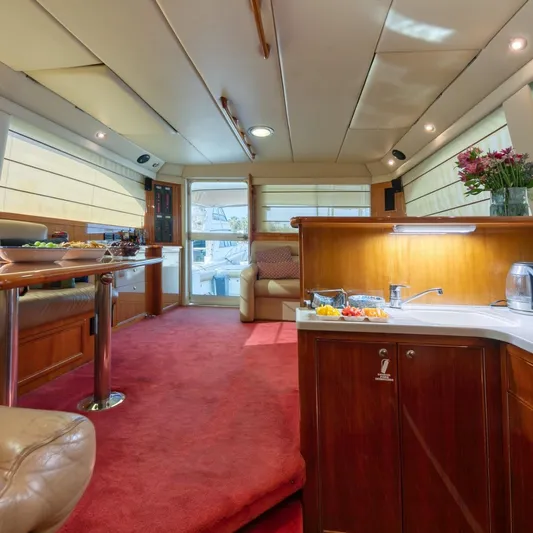  Yacht Photos Pics Luxurious interior of 2005 Riviera 47 Convertible Series II yacht with elegant furnishings.
