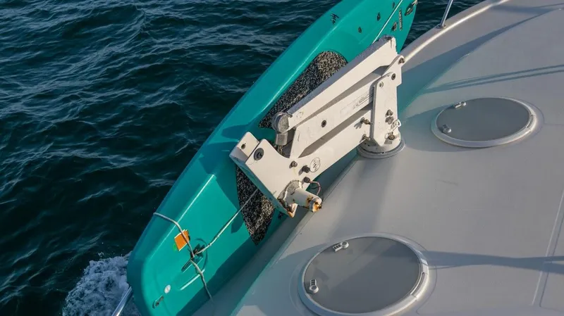  Yacht Photos Pics 2005 Riviera 47 Convertible Series II yacht deck with turquoise railing on the water.