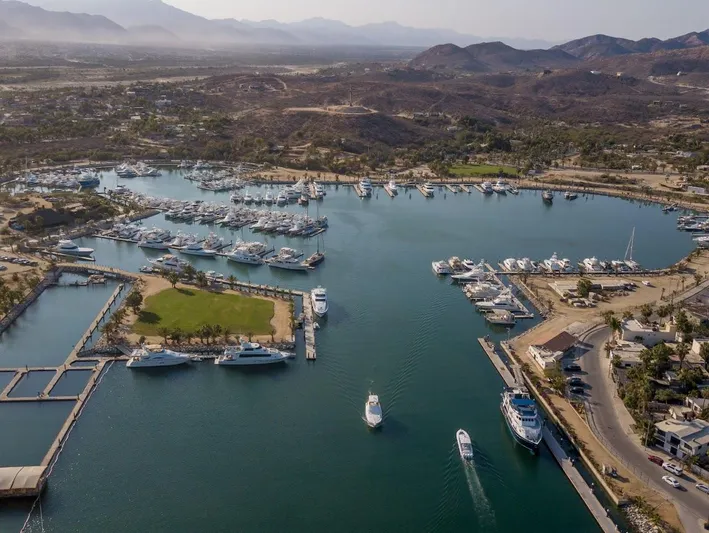  Yacht Photos Pics Aerial view of a marina with boats, including a 2005 Riviera 47 Convertible Series II.