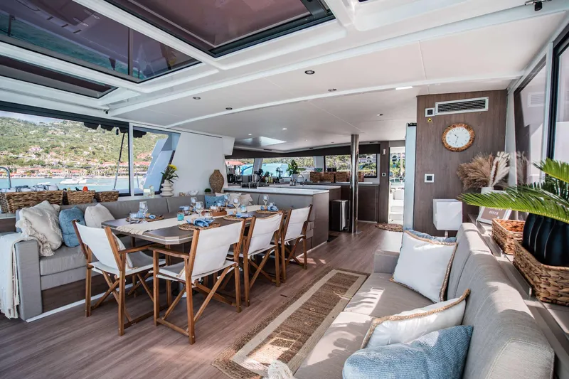 Southern Queen Yacht Photos Pics Luxurious interior of 2022 Bali 5.4 yacht with elegant dining area and scenic views.
