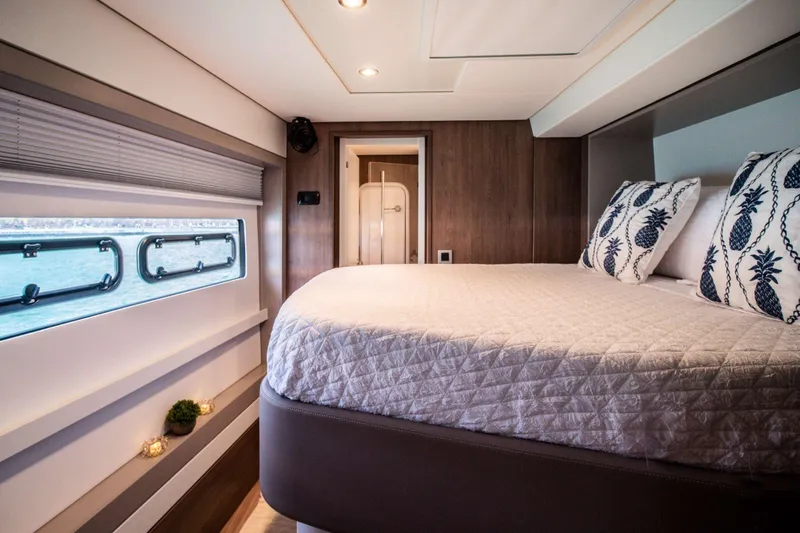 Southern Queen Yacht Photos Pics Luxurious bedroom interior of 2022 Bali 5.4 yacht with elegant bedding and sea view.