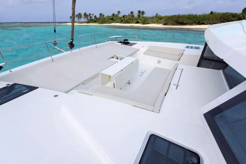 Southern Queen Yacht Photos Pics Luxurious 2022 Bali 5.4 yacht deck with ocean view and island backdrop.