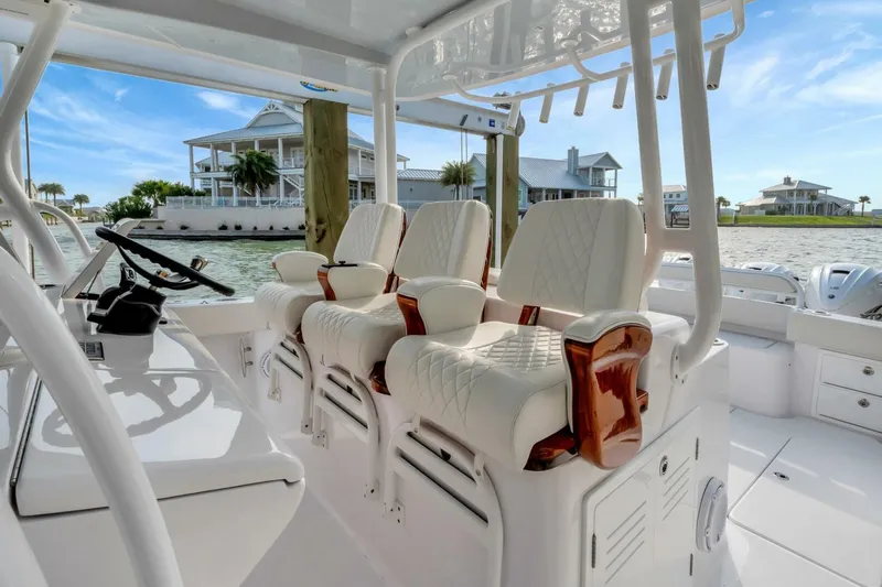 Aqua Toy Yacht Photos Pics 2023 Jupiter 43 Center Console boat with luxurious seating and waterfront view.