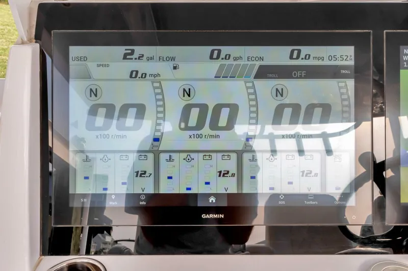 Aqua Toy Yacht Photos Pics Garmin display on 2023 Jupiter 43 Center Console showing engine and fuel metrics.