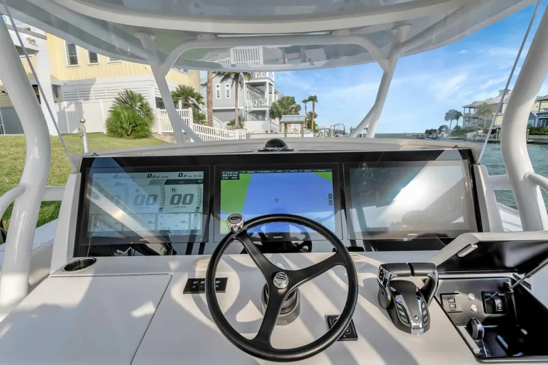 Aqua Toy Yacht Photos Pics 2023 Jupiter 43 Center Console boat dashboard with advanced navigation displays and controls.